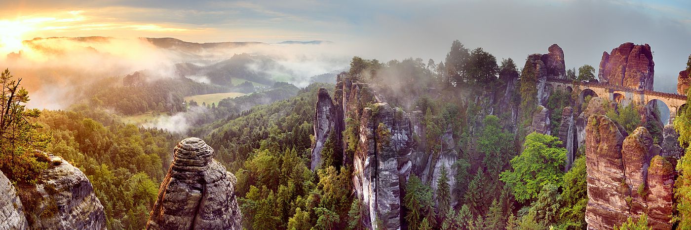 Saxon Switzerland Rocky mountains with trees against a sunny sky
